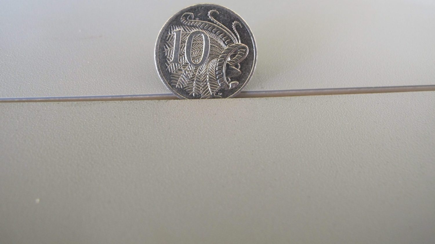 10 cent coin between vinyl