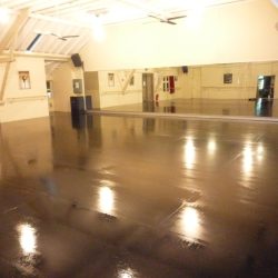 Juju performance clear floor finish on Weathertex floor stage primer masonite