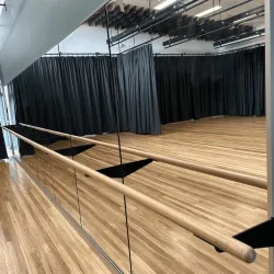 Barred mirror wall MWB curtains and floor in reflection